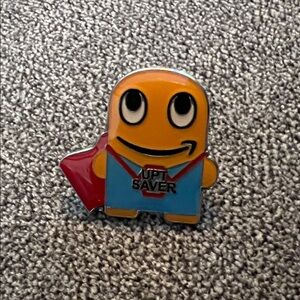 Superhero UPT saver Peccy Enamel Pin - Yellow, Blue & Red